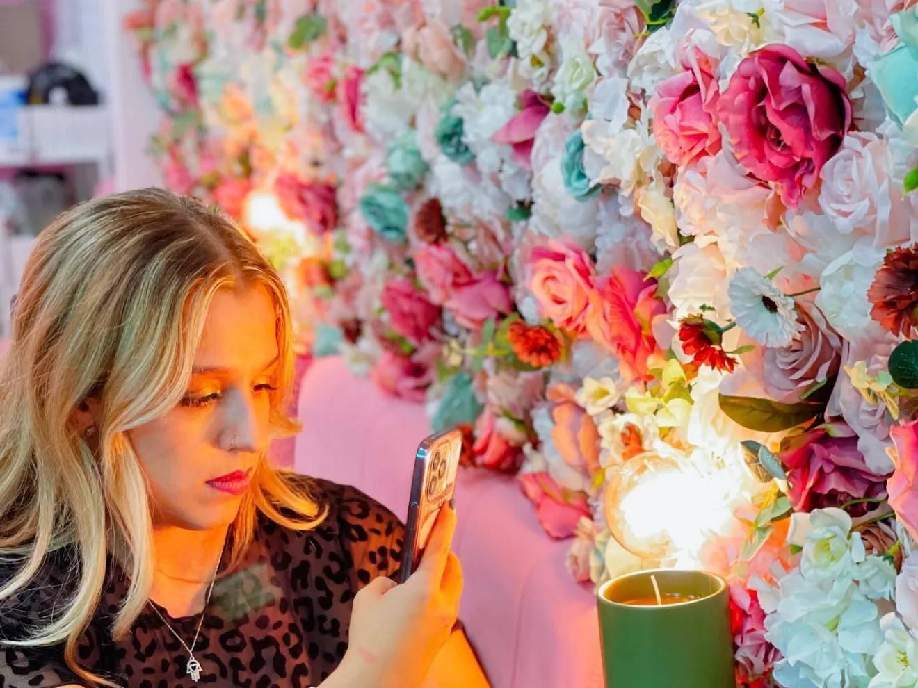 Woman Taking Photo of Candle