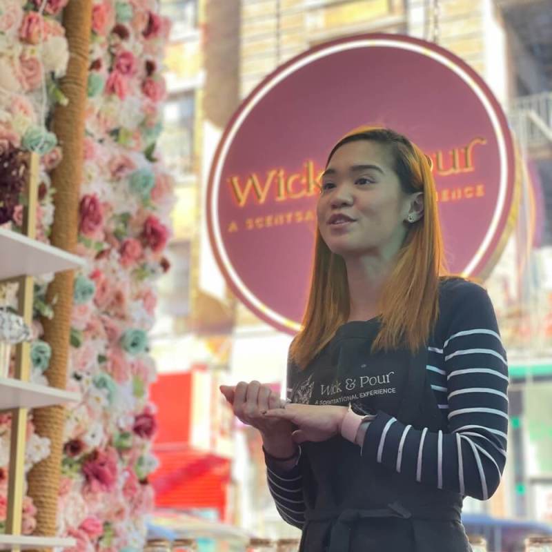 a woman standing in front of a building