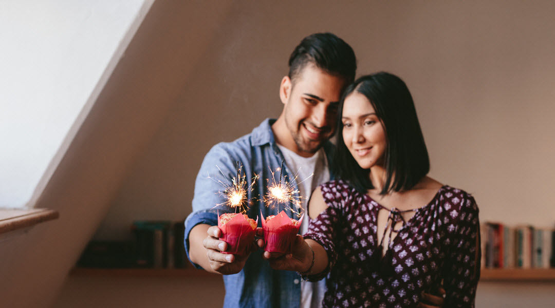 Couple Celebrating Anniversary with Custom Candle