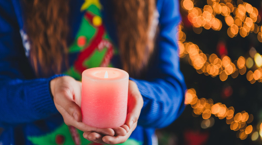 Lady Holding Christmas Candle